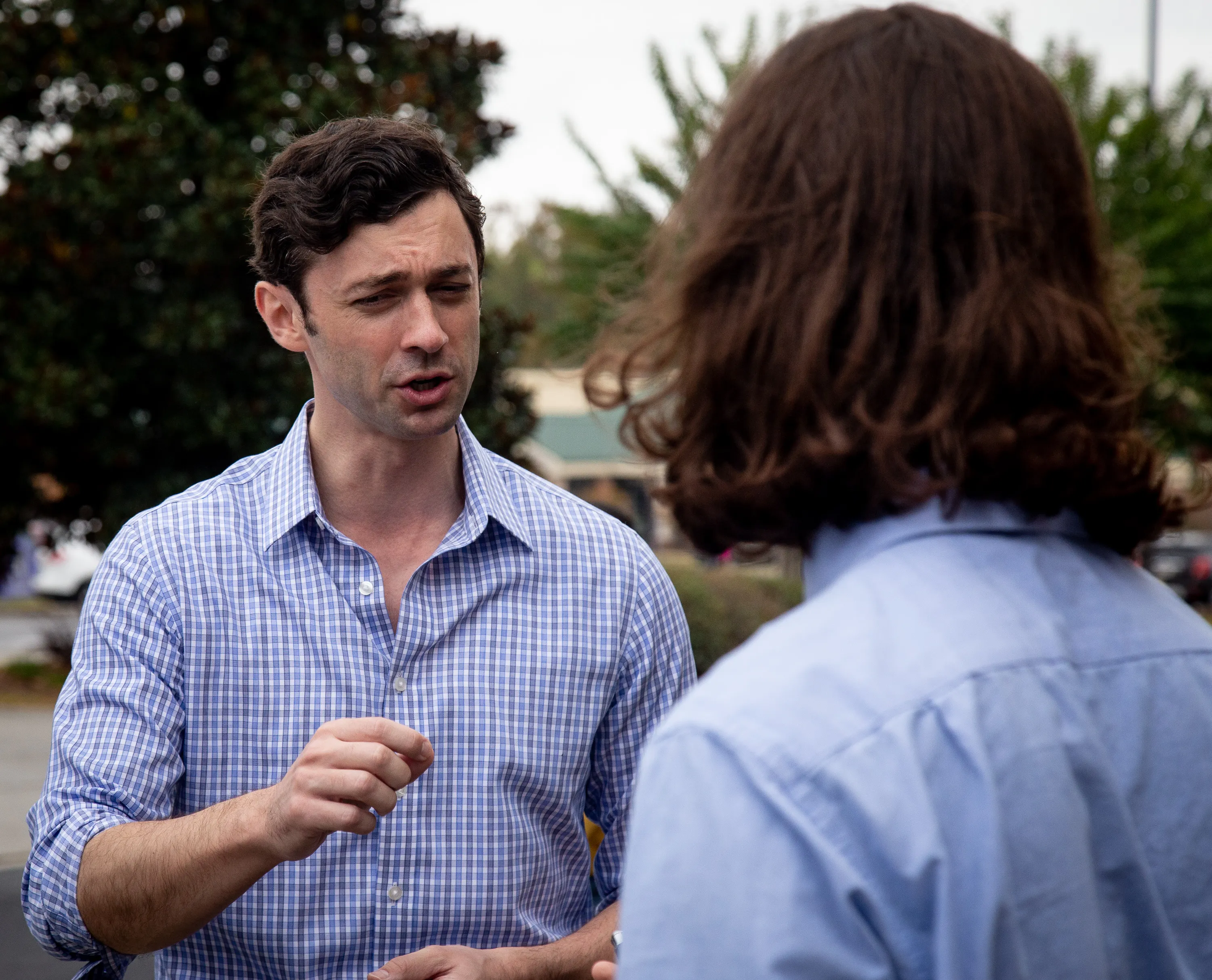 Adyson Harrah interviews U.S. Senator Jon Ossoff outdoors.